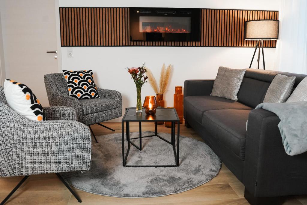 Stadtoase Wohnträumerei- Moderne Design Wohnung mit Ruhegarantie und gemütlichem Kamin in urbanem Ambiente photo 4