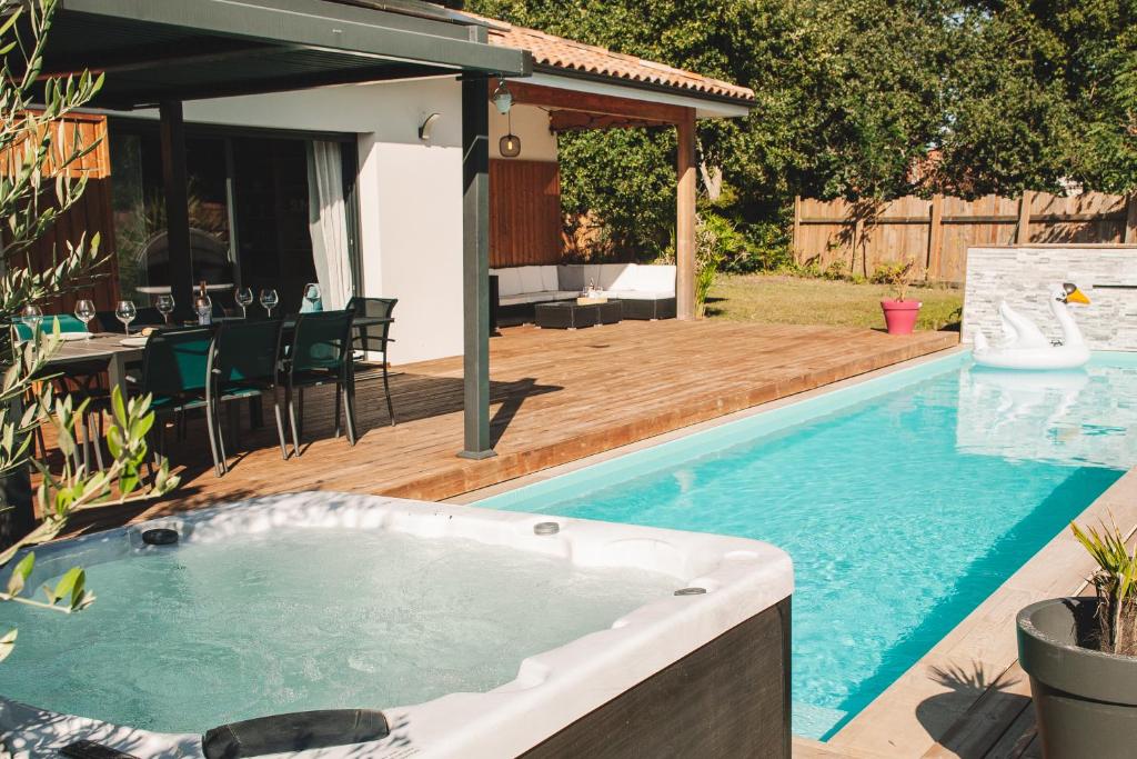 VILLA DREAM LANDES Piscine tempérée-Jacuzzi-5 suites parentales photo 3