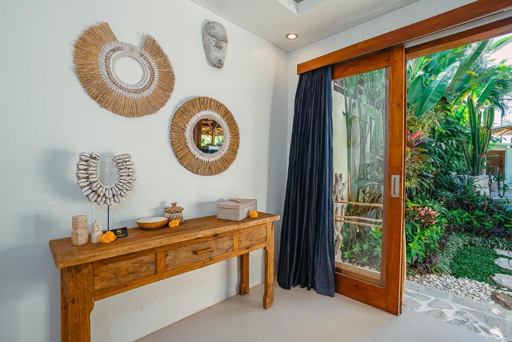 Villa Marula - Luxury 3BR Joglo Villa with Tropical Garden in Seminyak - Tap to explore photos