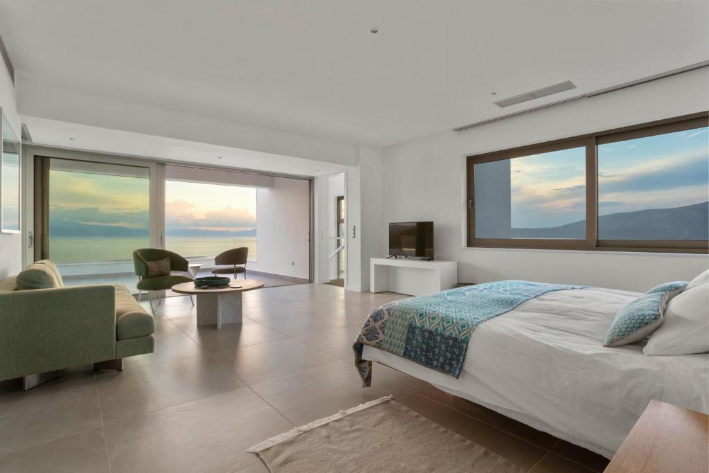 Villa Artemis - New Magnificent Beachfront Villa with Infinity Pool! photo 4