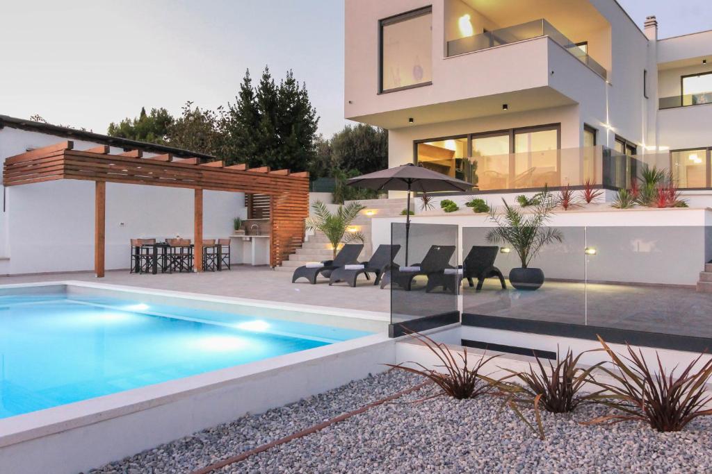 New modern luxury villa near the beach with sea view, pool, sauna , BBQ and playground photo 1