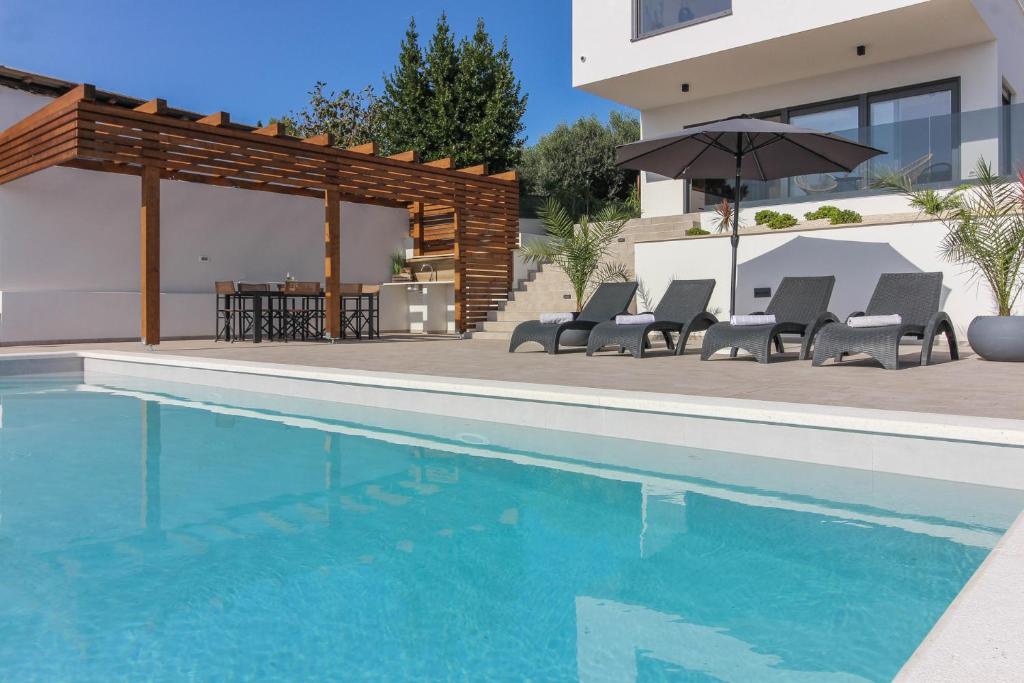New modern luxury villa near the beach with sea view, pool, sauna , BBQ and playground photo 3