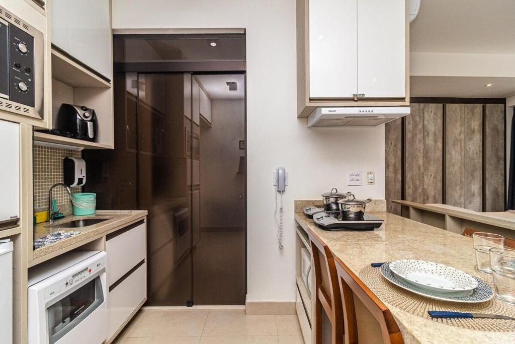 Studio moderno em condomínio de luxo pé na areia photo 1