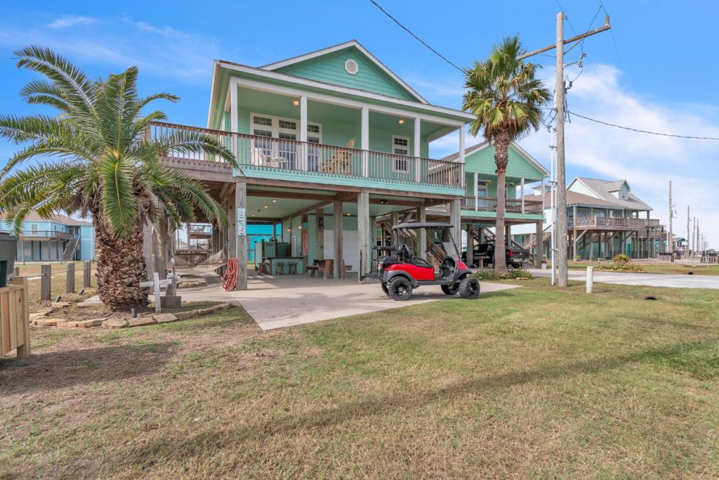 Steps to beach Golf Cart About Time Beach Retreat