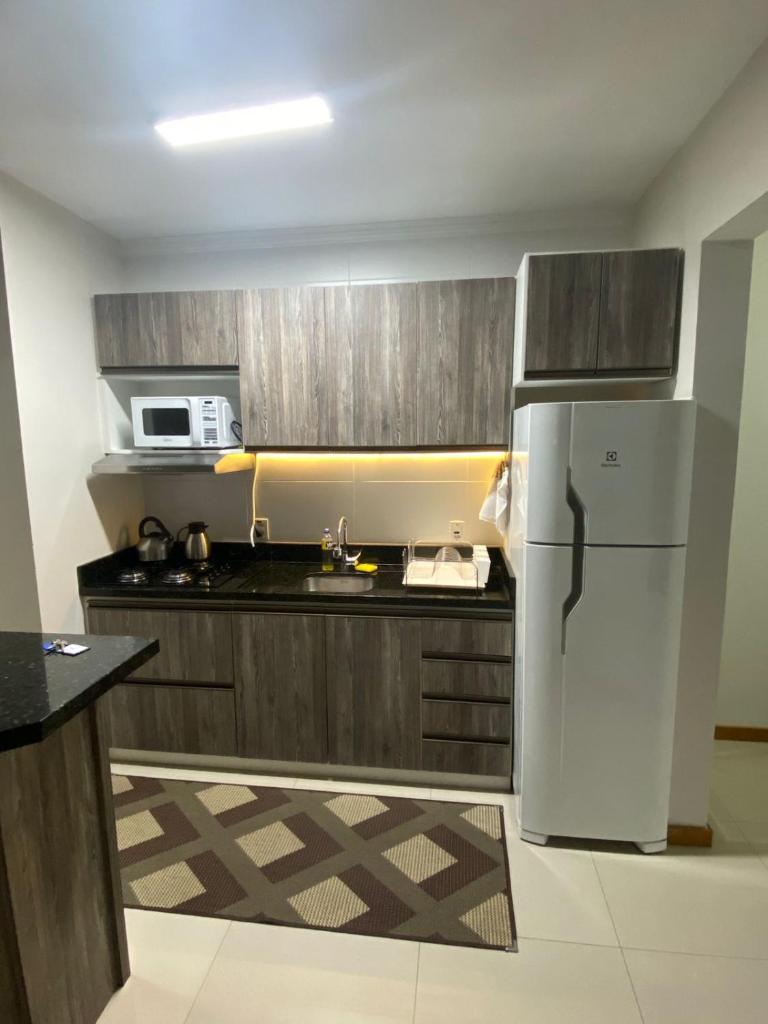 Apartamento NOVO completo com garagem e suíte no centro