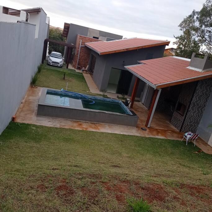 casa com piscina, 03 quartos, ótima localização! photo 3