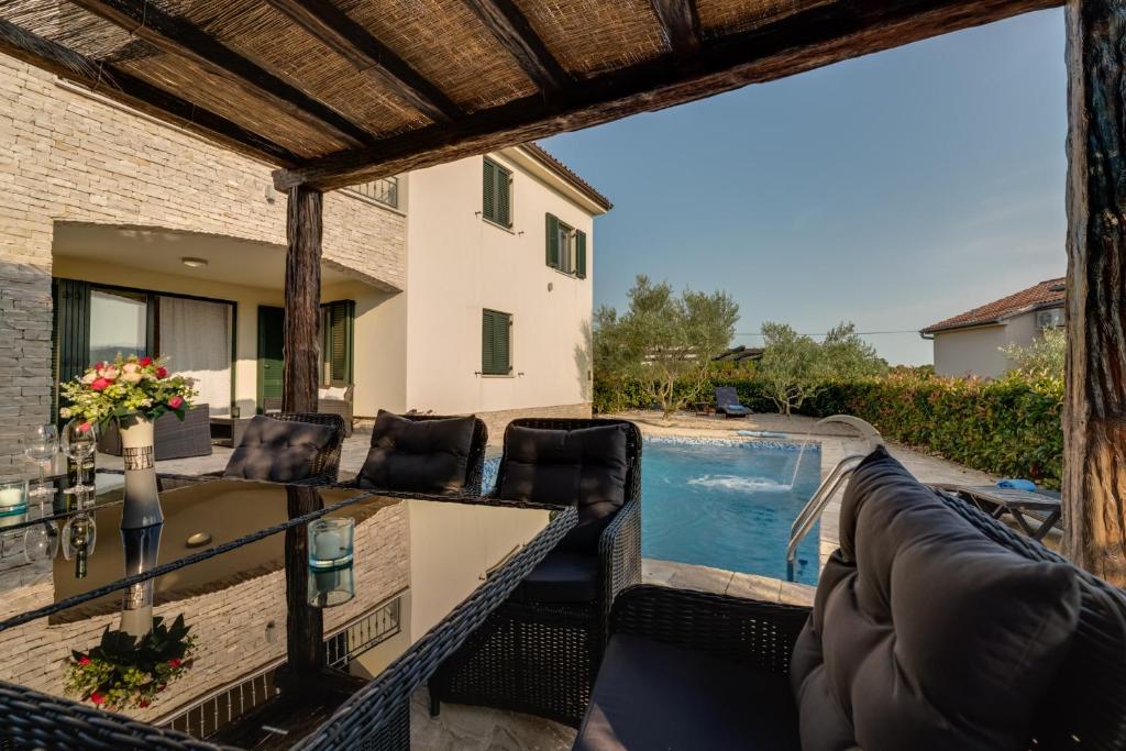 New villa with swimming pool, olive grove and sea view by Traveler tourist agency Krk ID 2201 photo 2