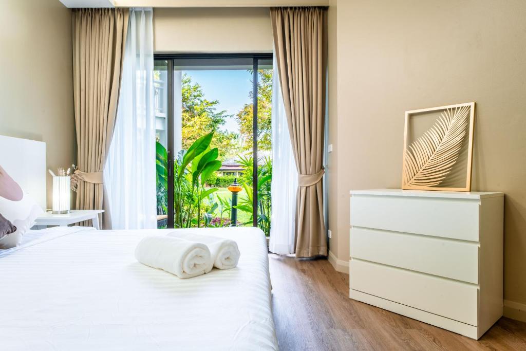 Allamanda Residences 2 BR with terrace Golf court view by NLA photo 4