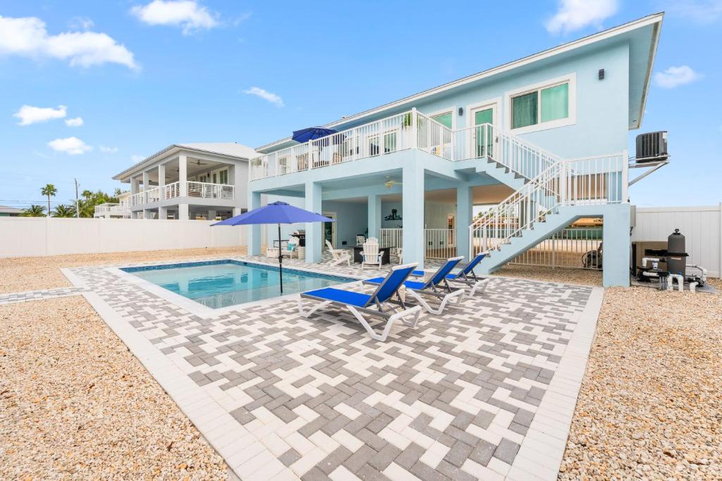 Blue Pearl New Waterfront Haven with Heated Pool ,70 Foot Dock, and More! photo 1
