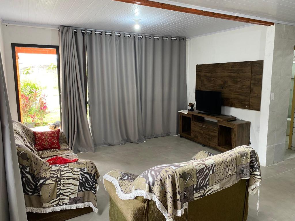 Casas de Veraneio em Torres - Frontal photo 1