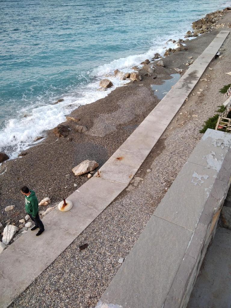 House next to the sea side photo 2