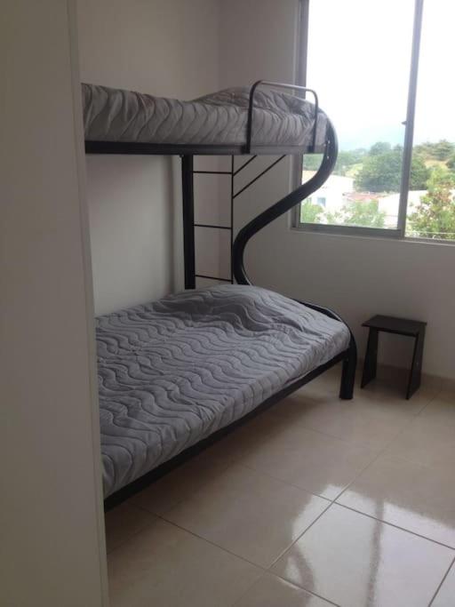 Espectacular apartamento,RICAURTE parqueadero,piscinas,aire photo 2