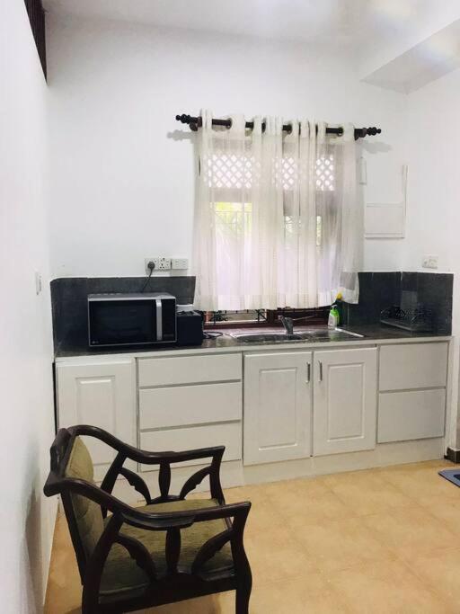 Comfortable and serene cottage surrounded with palms and tamarind tree photo 4
