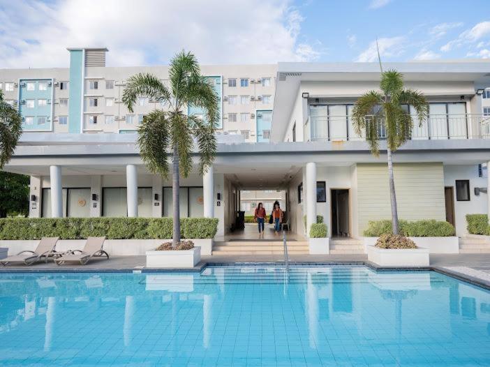 Affordable 2 Bed Condo Rental in Davao City with Wifi & Netflix, Swimming Pool, Gym & Billiard Hall photo 1