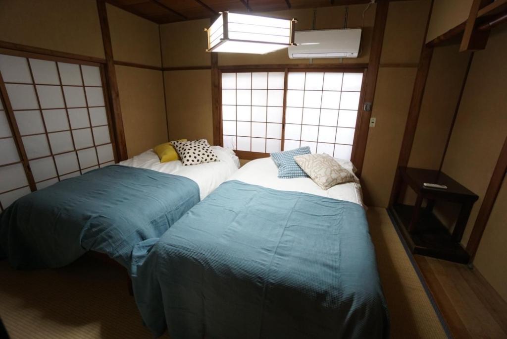 Family Home Dotonbori House - Tap to explore photos