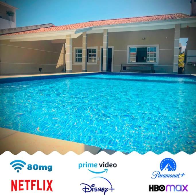 Casa de praia com piscina e churrasqueira - Indaiá Bertioga photo 1