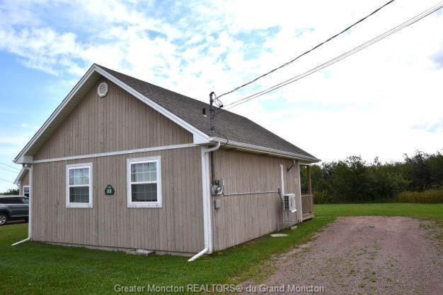 Seabreeze Aboiteau Cottage - beach access photo 1