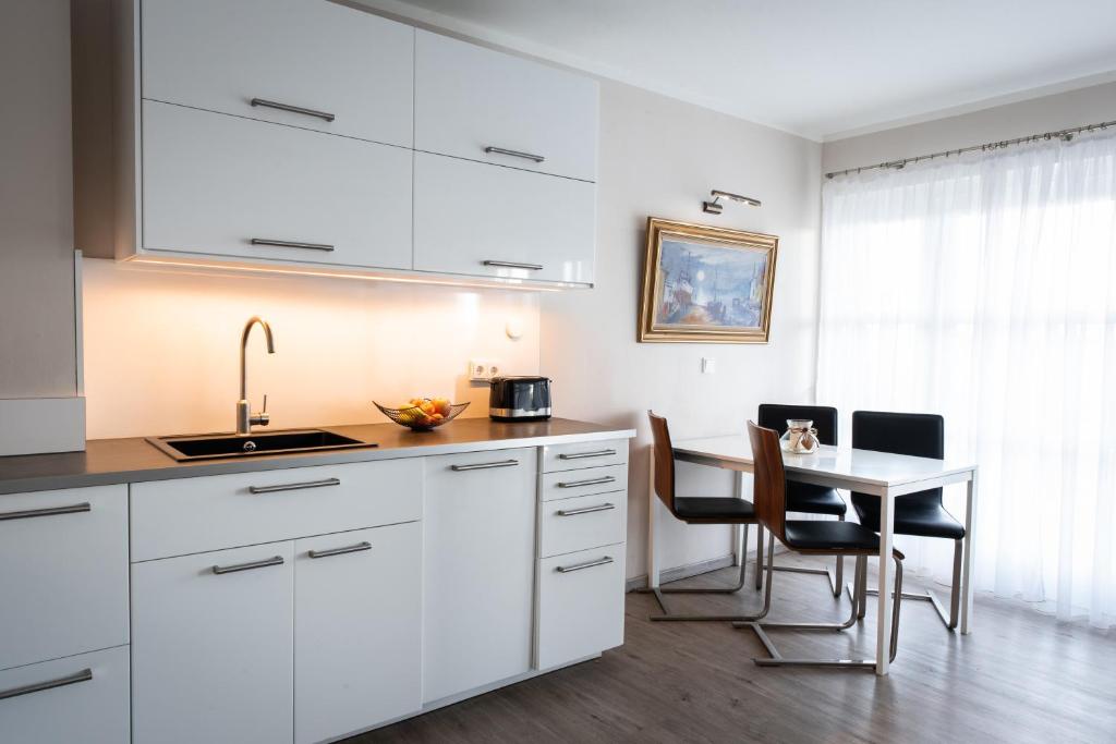 Moderne Wohnung mit großer Terrasse in erster Reihe am Deich, Wallbox, Kajak photo 1