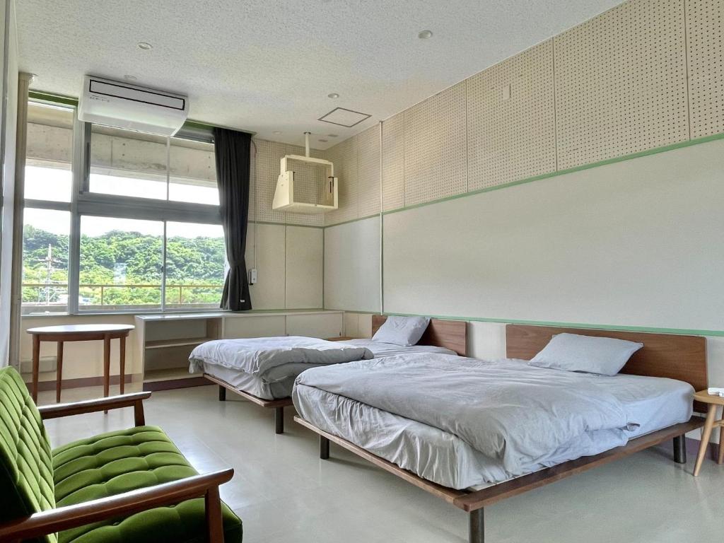LivingAnywhere Commonsうるま twin bed room - Vacation STAY 88989v photo 1