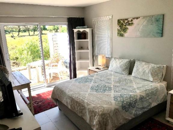 HIDDEN GEM - A Unique Seaside-Game Reserve-Golf Estate-Heated Lap Pool 6 sleeper 3 Bedroom Home with 2 Queen Suites and 1 bedroom with 2 single beds photo 3