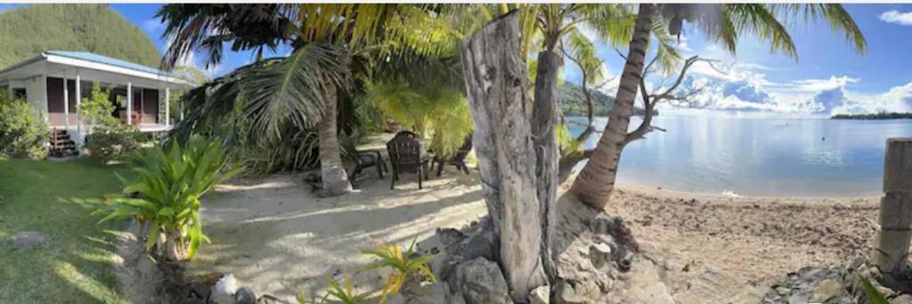 Les pieds dans l’eau à huahine. Maison climatisée photo 1