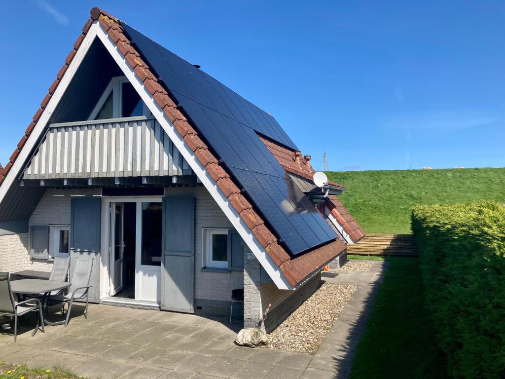 am Deich 6 pers House with a private terrace behind a dike by the Lauwersmeer