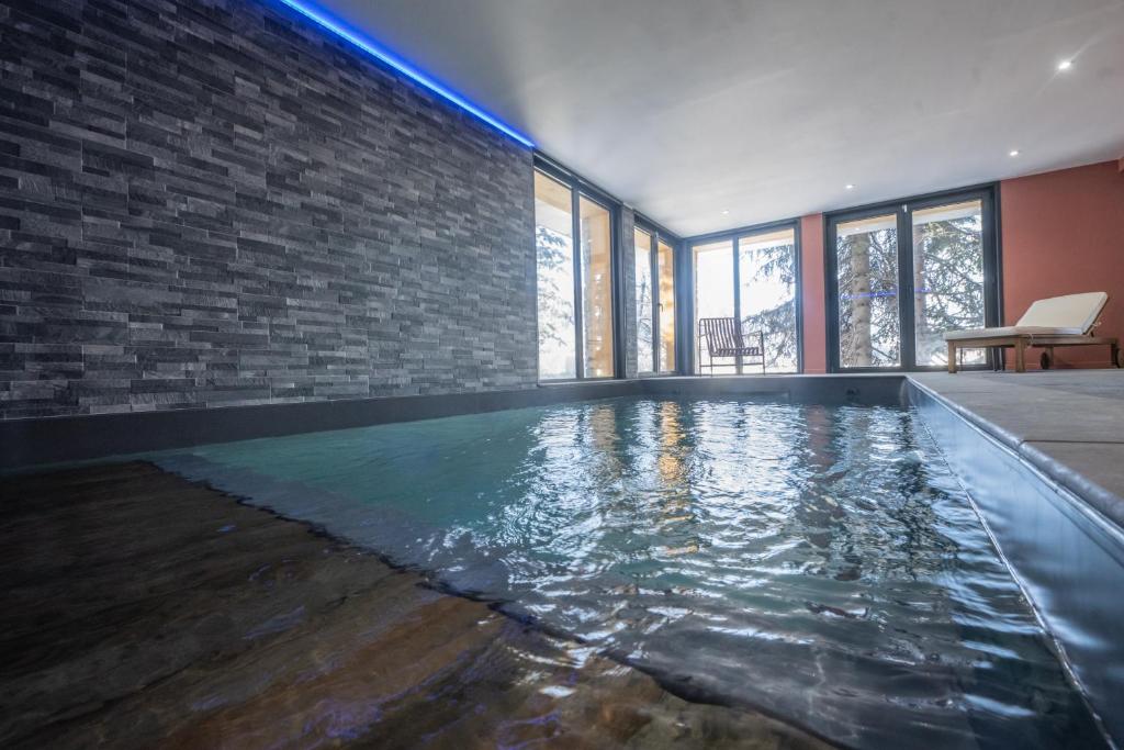 Chalet du Bois Melay 5 étoiles - La Plagne 1800 - piscine - proche pistes - 15 personnes photo 1