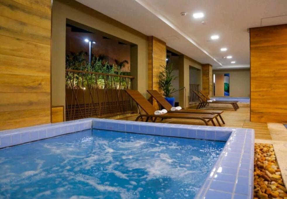 Flat encantador com piscinas aquecidas, academia e playground photo 1