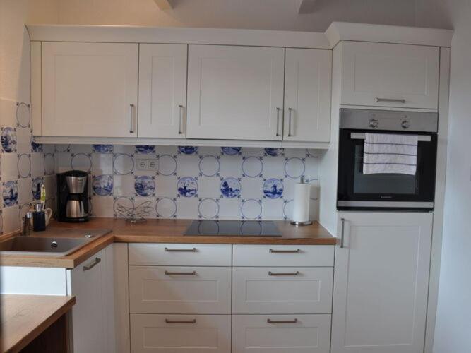 Holiday home witch's house in Rysum photo 2