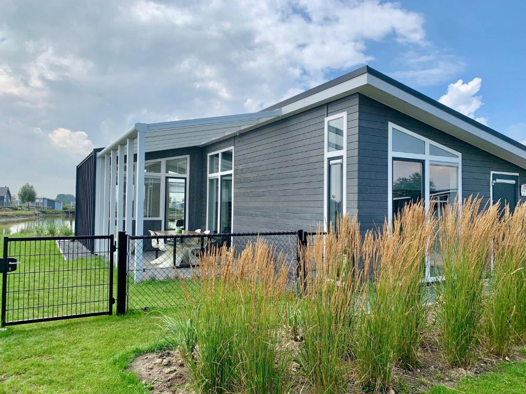 Modern chalet with jetty and terrace near the Oosterschelde photo 3