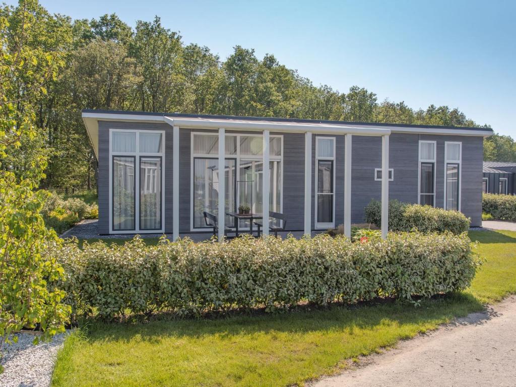 Modern cottage with a fireplace near the Oosterschelde
