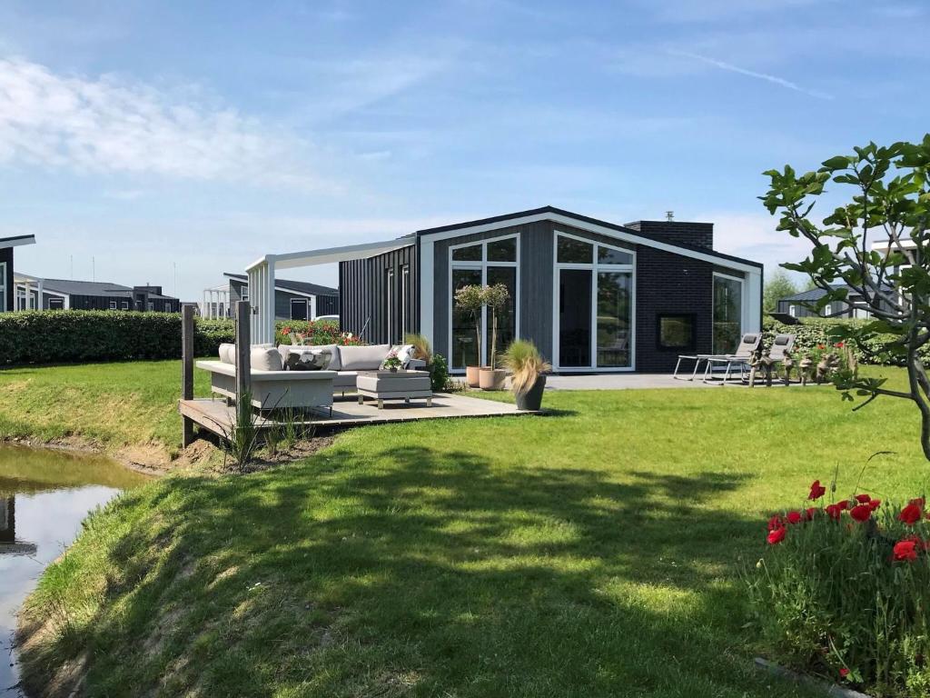 Modern chalet with a fireplace near the Oosterschelde