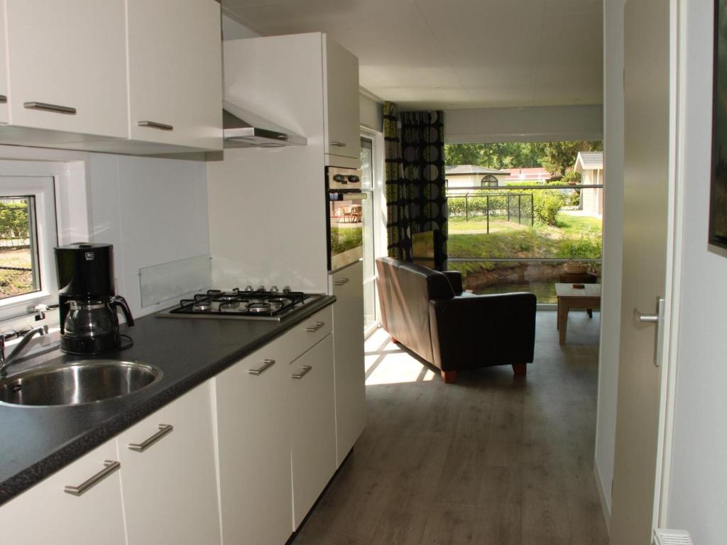 Modern chalet with a terrace and near a pond photo 3