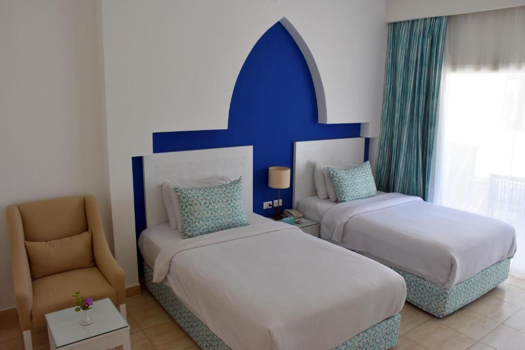 Sharm Club Beach Resort - Tap to explore photos