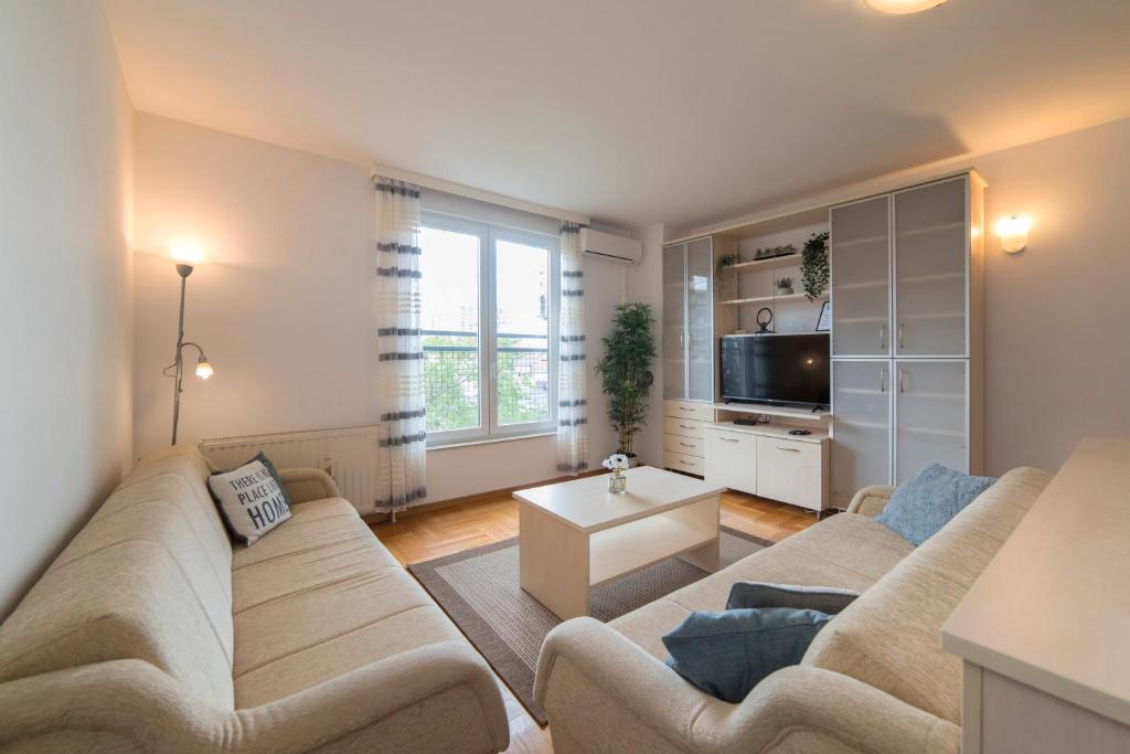Marci Apartment - Comfortable Stay with Parking - Tap to explore photos