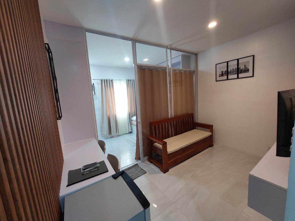 Twin Hearts Residences Unit 215 - Tap to explore photos