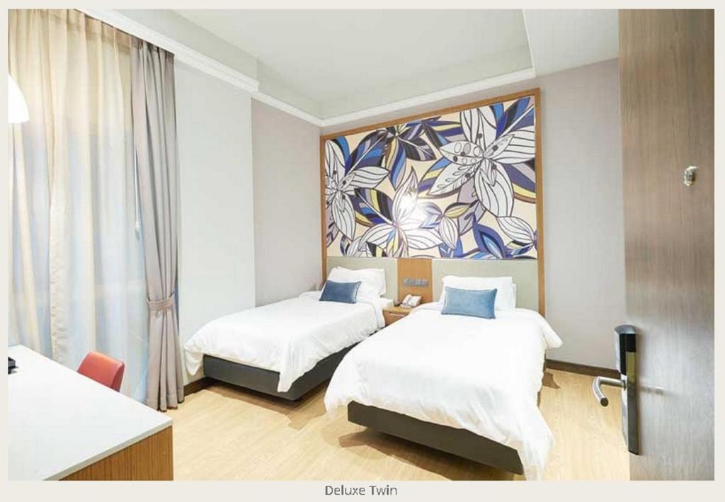 Двухместный (Двухместный номер Делюкс с 2 отдельными кроватями), Hotel Bencoolen @ Hong Kong Street
