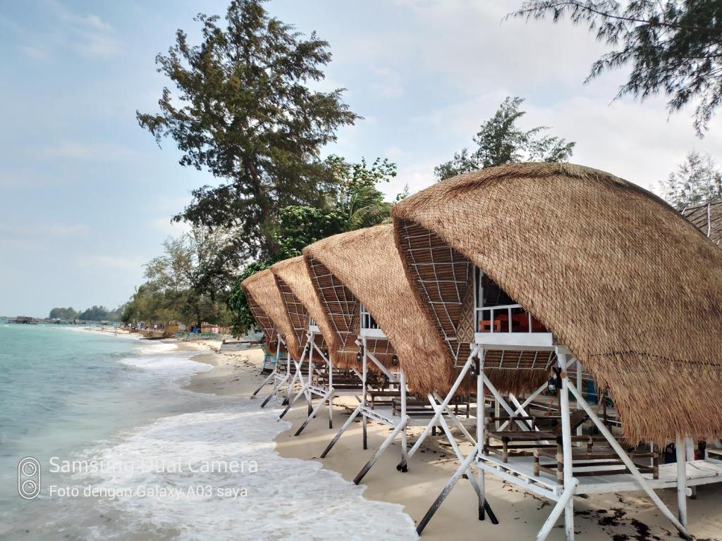Madu Tiga Beach and Resort - Tap to explore photos
