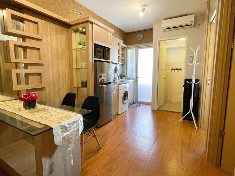 Modern 2BR Educity Apartment, Pakuwon City - Tap to explore photos