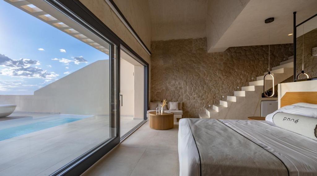 Pnoé Luxury Suites - Tap to explore photos