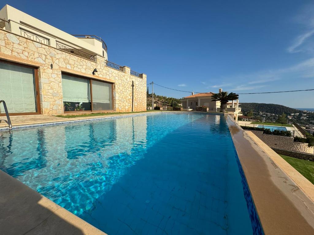 Stone Villa Saronida - Tap to explore photos