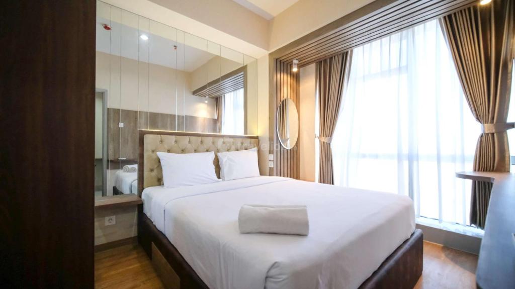 Nice and Comfortable Living 1BR at Grand Sungkono Lagoon Apartment By Travelio, Sidoarjo