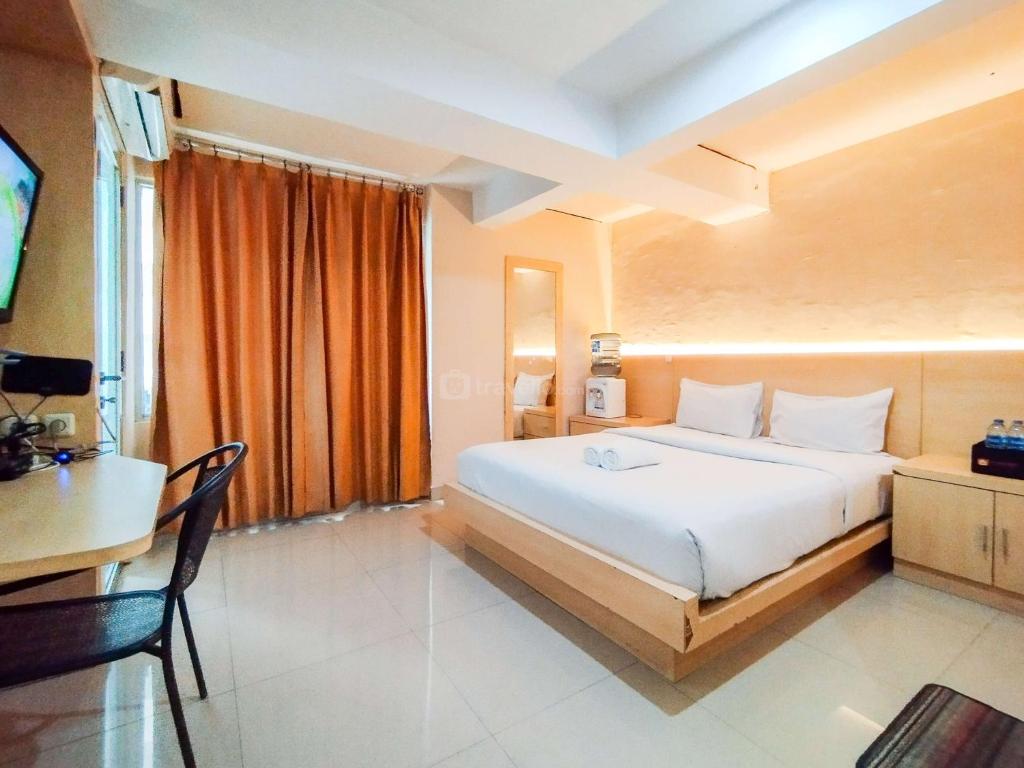 Cozy Style Studio Room at Jarrdin Cihampelas Apartment By Travelio