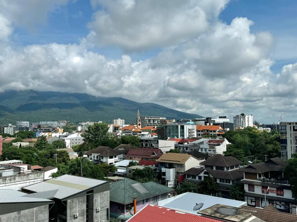 Charm Suite Nimman with Rooftop - Tap to explore photos