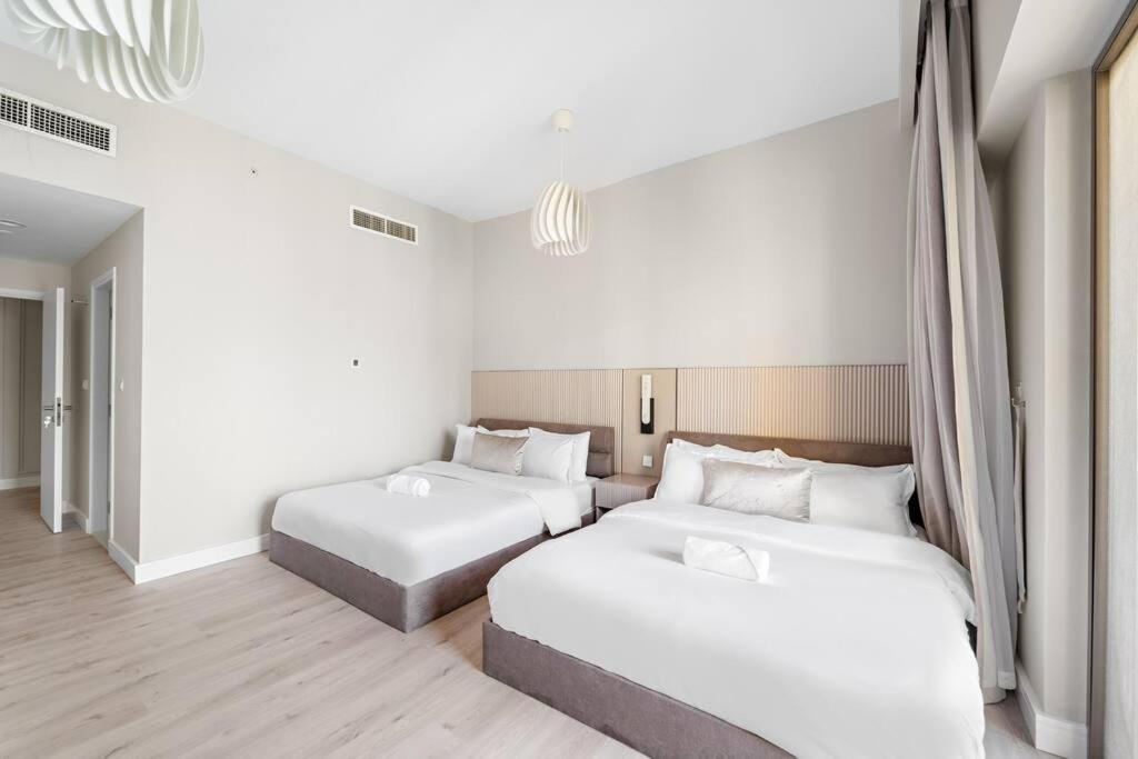 FIRST CLASS 2BR Breathtaking Beach & Palm View - Tap to explore photos