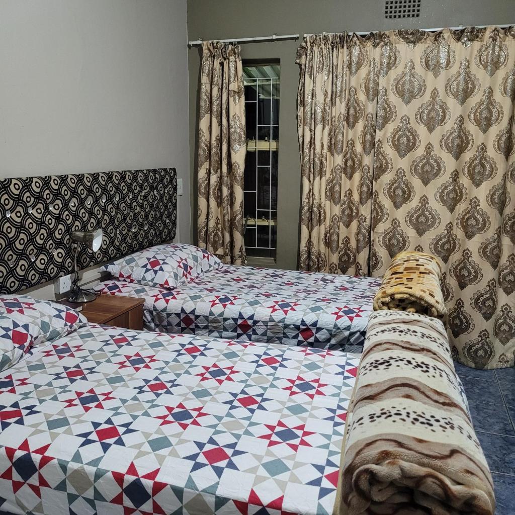 Delapaix Guest lodge Room Type - Twin Room with Private Bathroom