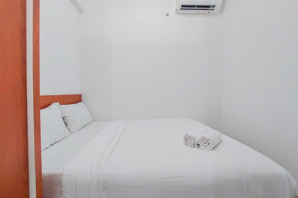 Warm and Minimalist 2BR at Serpong Garden Apartment By Travelio, Tangerang