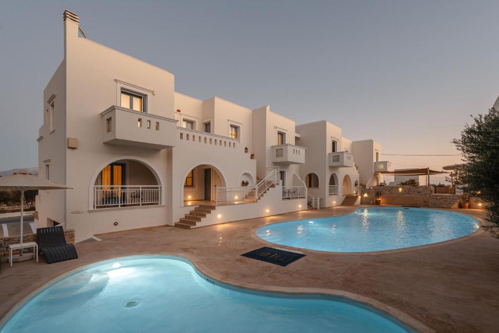 Mitos Suites - Tap to explore photos