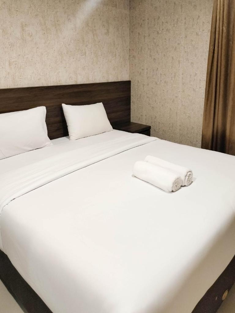 Comfort and Simply 1BR at Patraland Amarta Apartment By Travelio