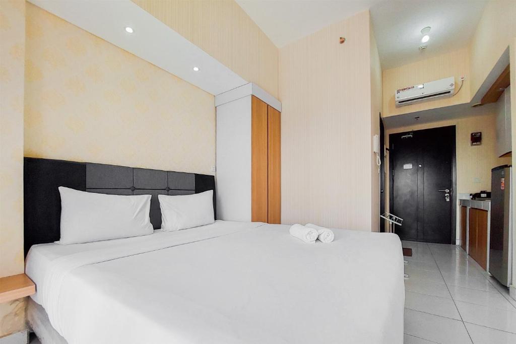 Comfort Living and High Floor Studio Casa de Parco Apartment By Travelio, Tangerang